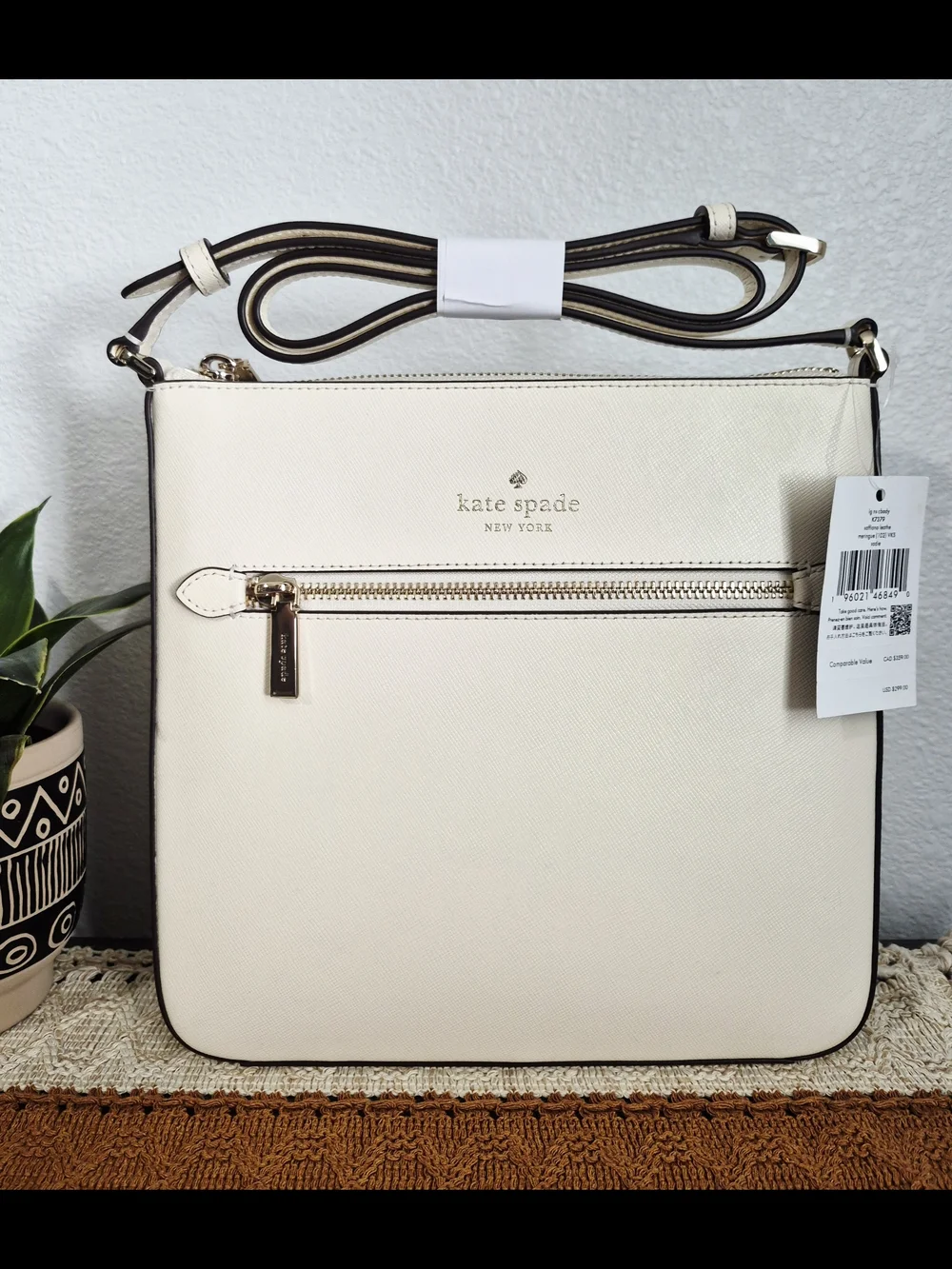 Kate Spade Sadie Cream Saffiano Leather crossbody with front zip